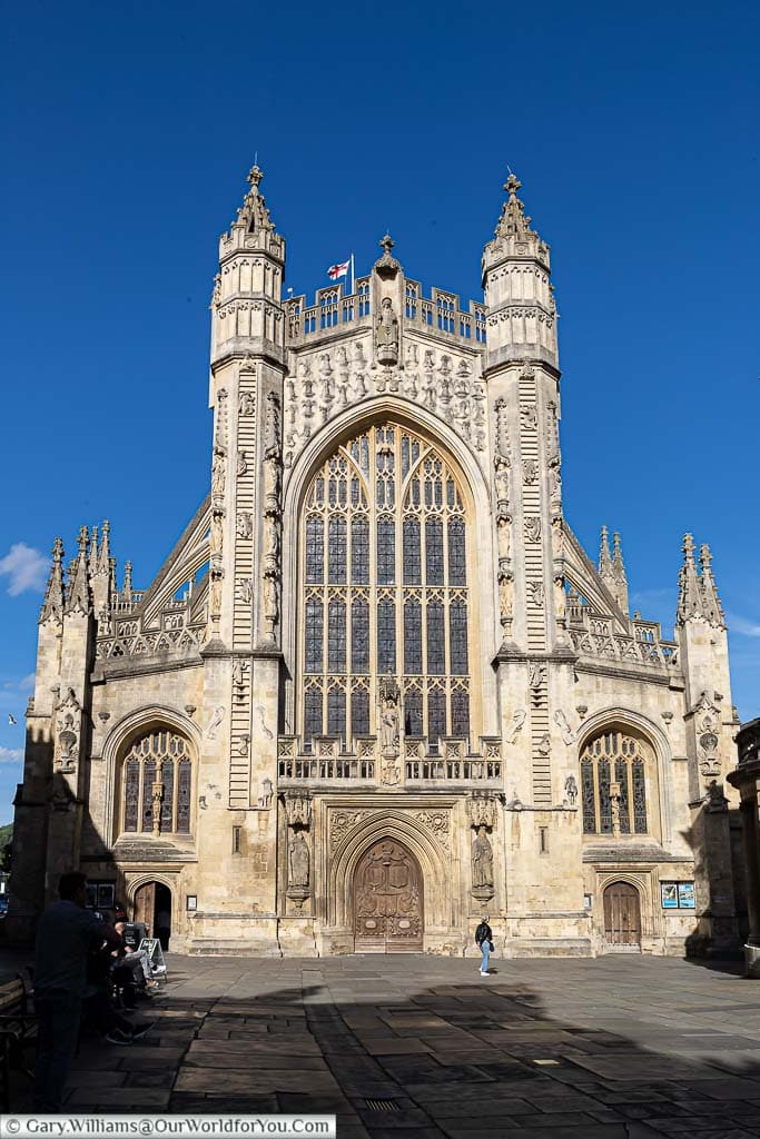 The west front of Bath Abbey from Abbey Churchyard in the golden evening sunlight, a must see in Bath.