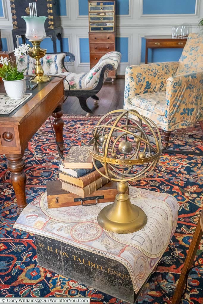 An armillary sphere, set on a map of the earth, within the blue parlour of Lacock Abbey in Wiltshire.