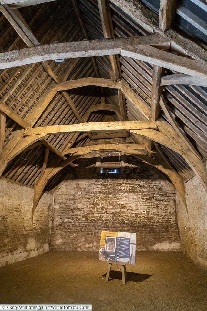 An information board inside the Tithe Barn in the National Trust Village of Lacock, Wiltshire