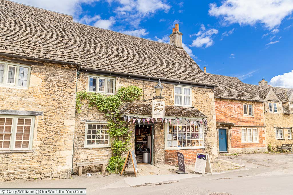 Bunting surrounds the traditional-looking Lacock Bakery in it's 15th-century rubble stone and stone slate roof building