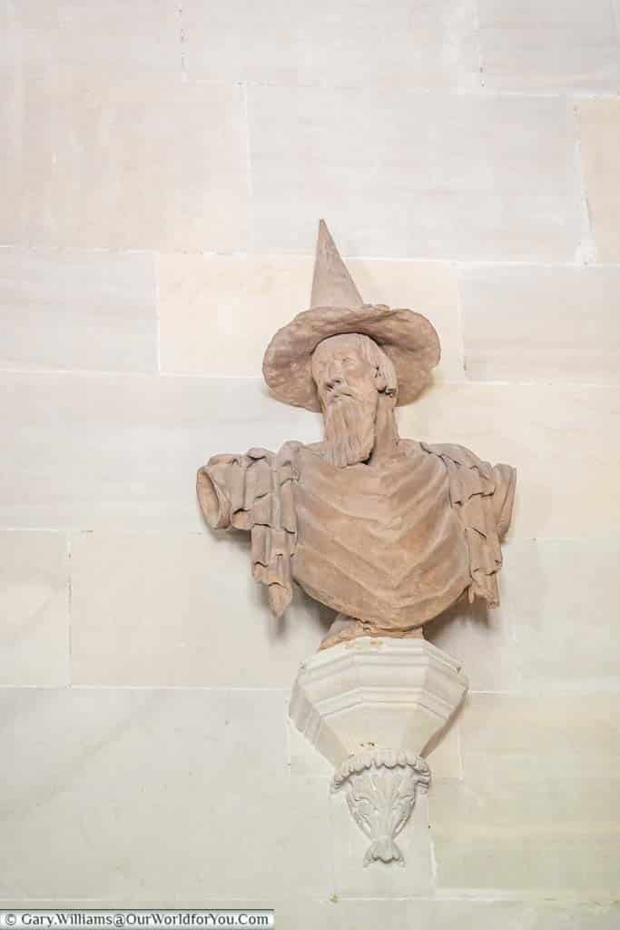 A stone bust of a wizard in the grand hall of Lacock Abbey