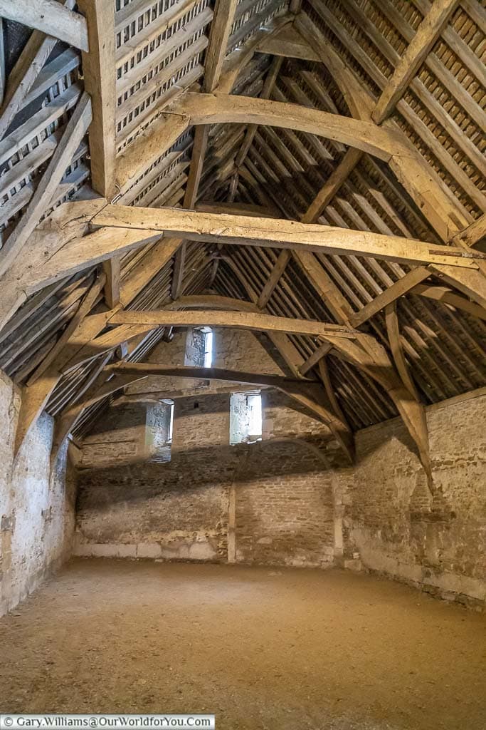 The wooden vaulted ceiling of the Tithe Barn in the National Trust Village of Lacock, Wiltshire