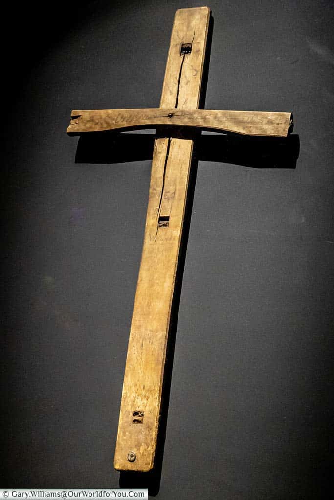 An exhibit in the 'In Flanders Field Museum' of a grave marker constructed from a wooden chair.