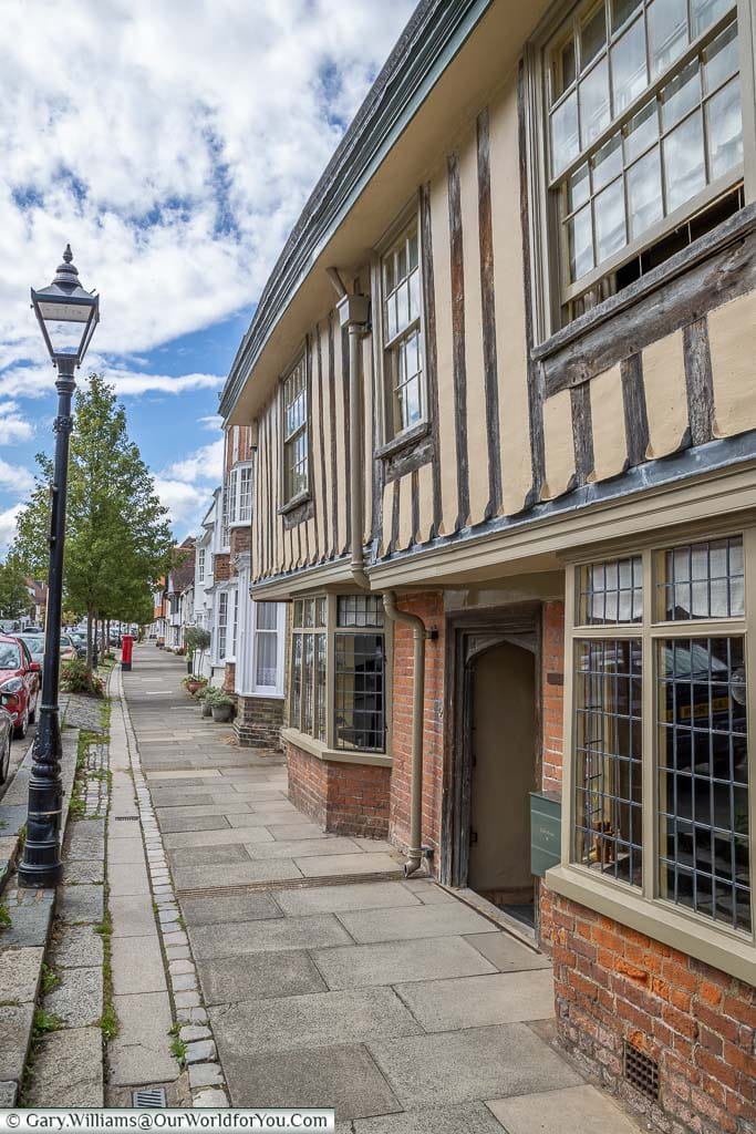 Globe House, a half-timbered building on Abbey Street with its flagstone paths and traditional street lighting. In the picturesque town of Faversham in Kent