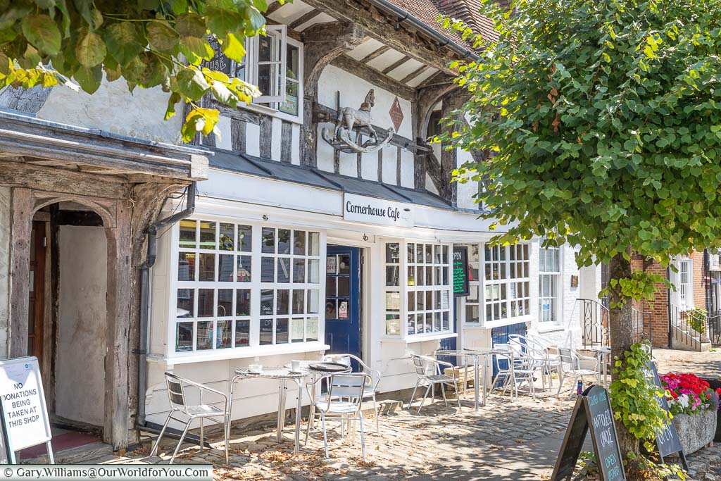 Tables and chairs outside the half-timbered Cornerhouse Café in Lenham
