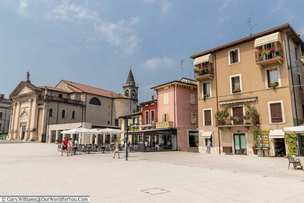 A scene from a piazza in front of the Duomo di San Martino, Peschiera del Garda.