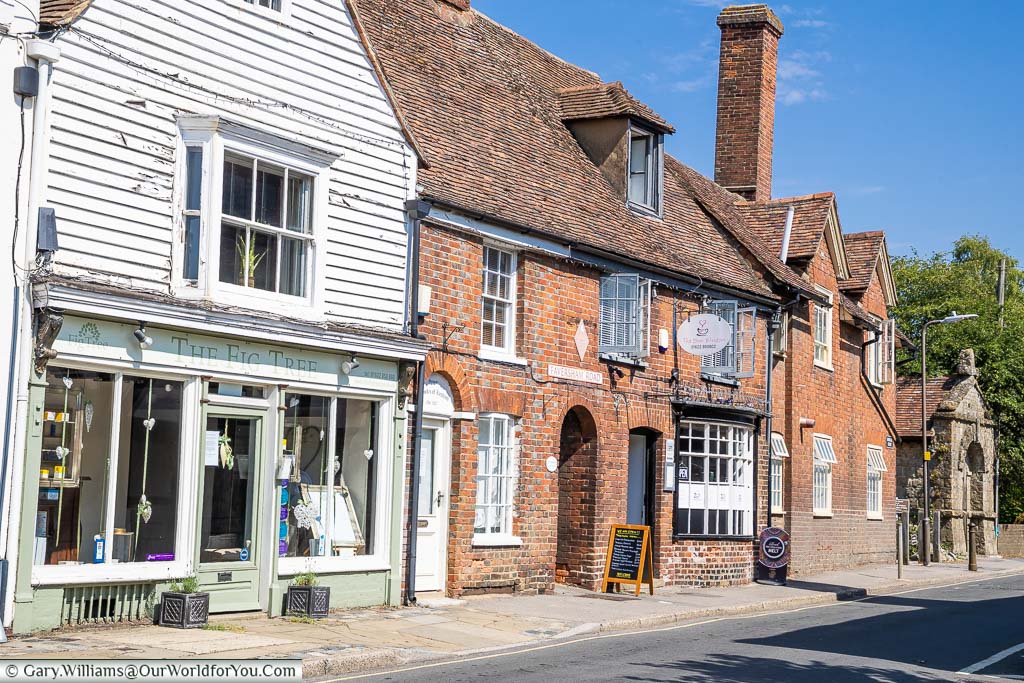 A picturesque street view of Faversham Road in Lenham with it's historic Red Brick buildings and the 18th-century mortuary