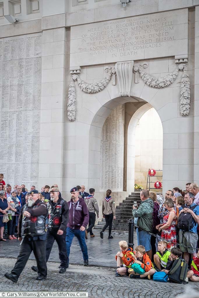 A group of ex-servicemen laying wreaths at the Last Post Ceremony within the Menin Gate in Ypres