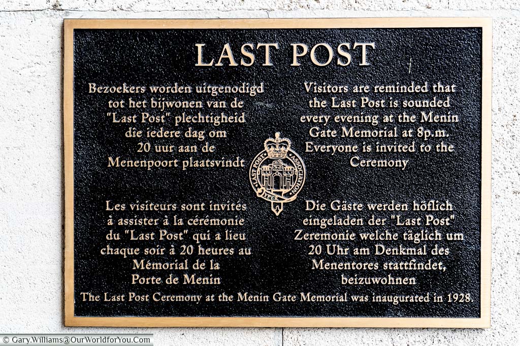 The iron black and gold Last Post sign on the Menin Gate in Ypres, Belgium
