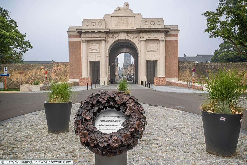 The bronze poppy wreath on a plinth on an island in front of the Menin Gate in Ypres, Belgium