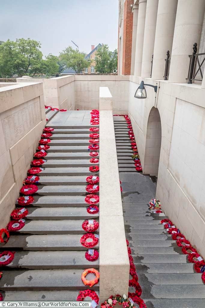 Poppy wreaths line either side of the staircase on the outer edge of the Menin Gate in Ypres