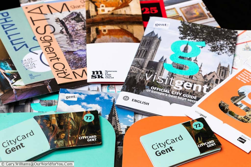 A selection of leaflets and Two Gent CityCards laid out on a table to provide plenty of inspiration for our visit to Ghent.