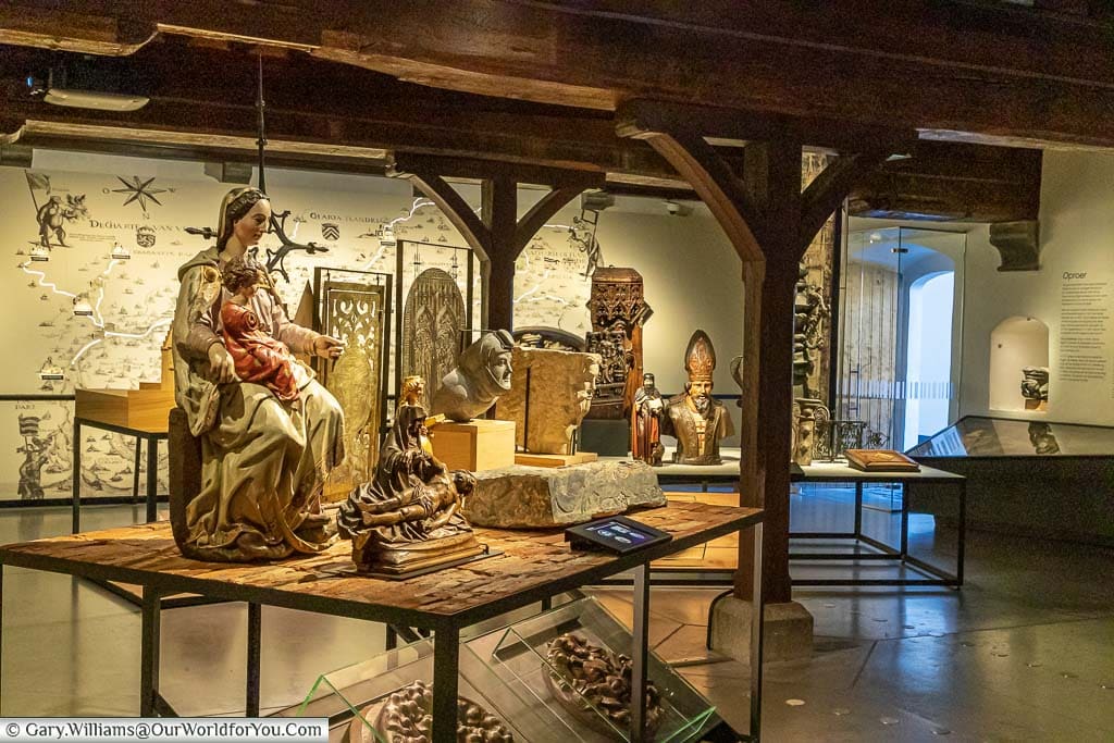 A room in the Ghent City Museum full of religious artifacts from the Flemish city through the ages.