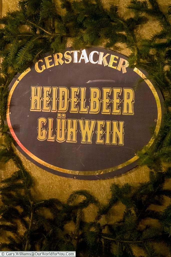 A sign for the Heidelbeer Glühwein on the side of a nuremberg christmas market stall in germany