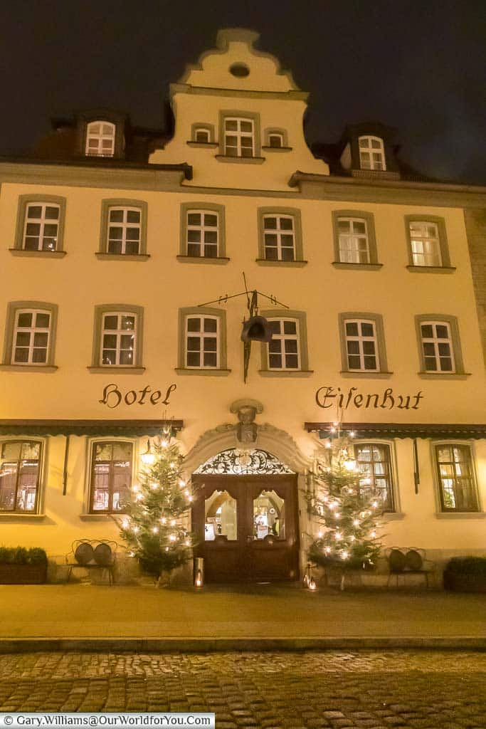 The entrance, decorated for christmas, to hotel eisenhut in the centre of rothenburg ob der tauber at night.