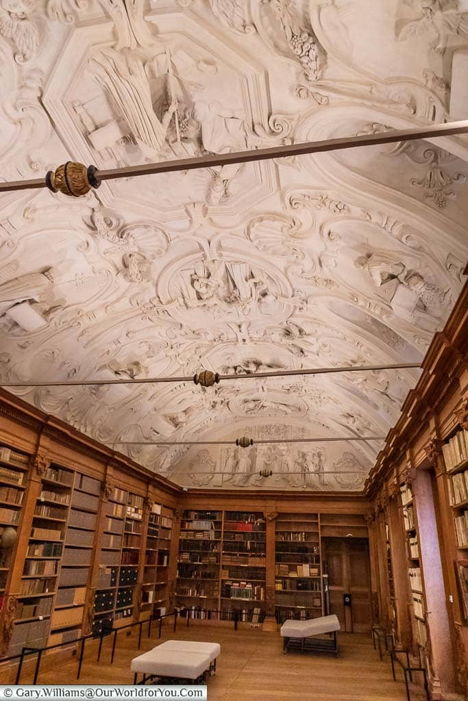 The ornately white stucco ceiling above the Park Abbey library in leuven, belgium.