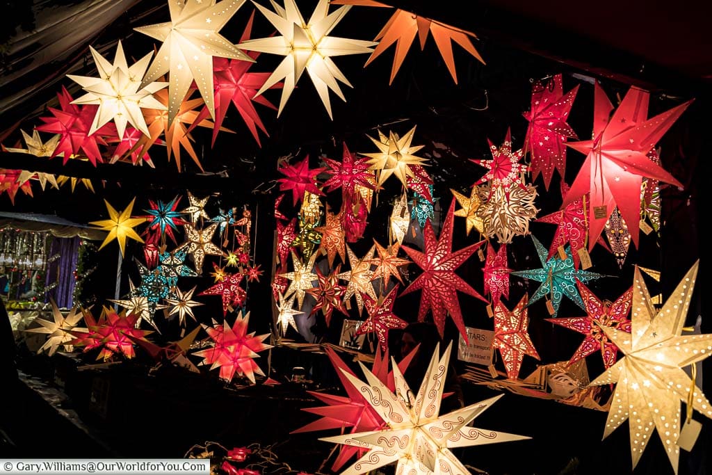 A Christmas market stall in Nuremberg packed with illuminated paper stars.