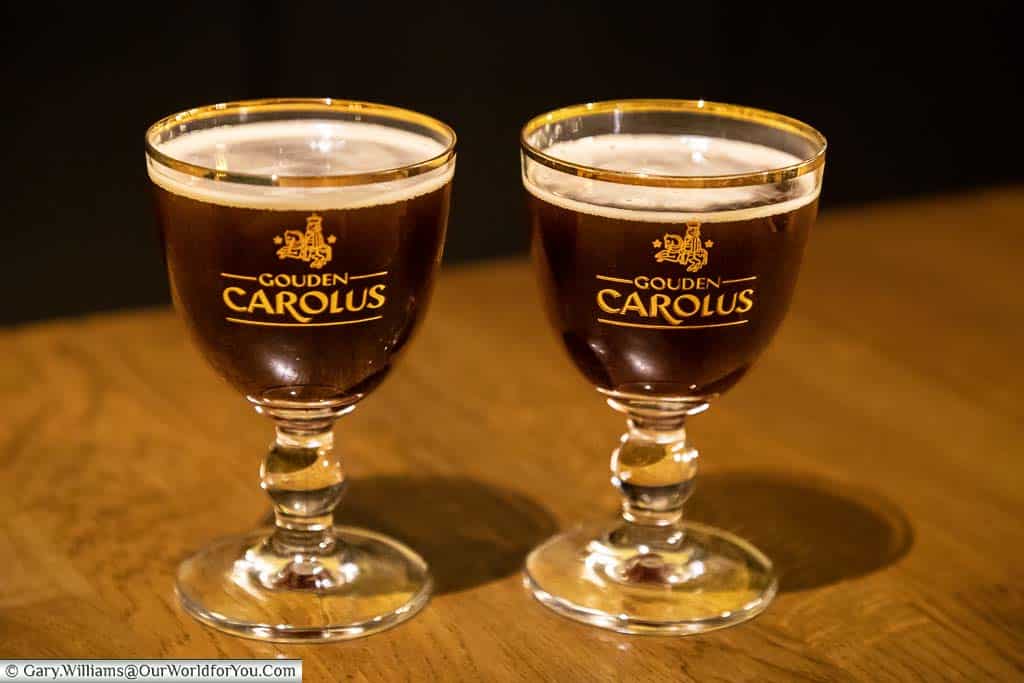 Two glasses of the dark chocolate brown gouden carolus classic from the het Aanker brewery in mechelen, belgium