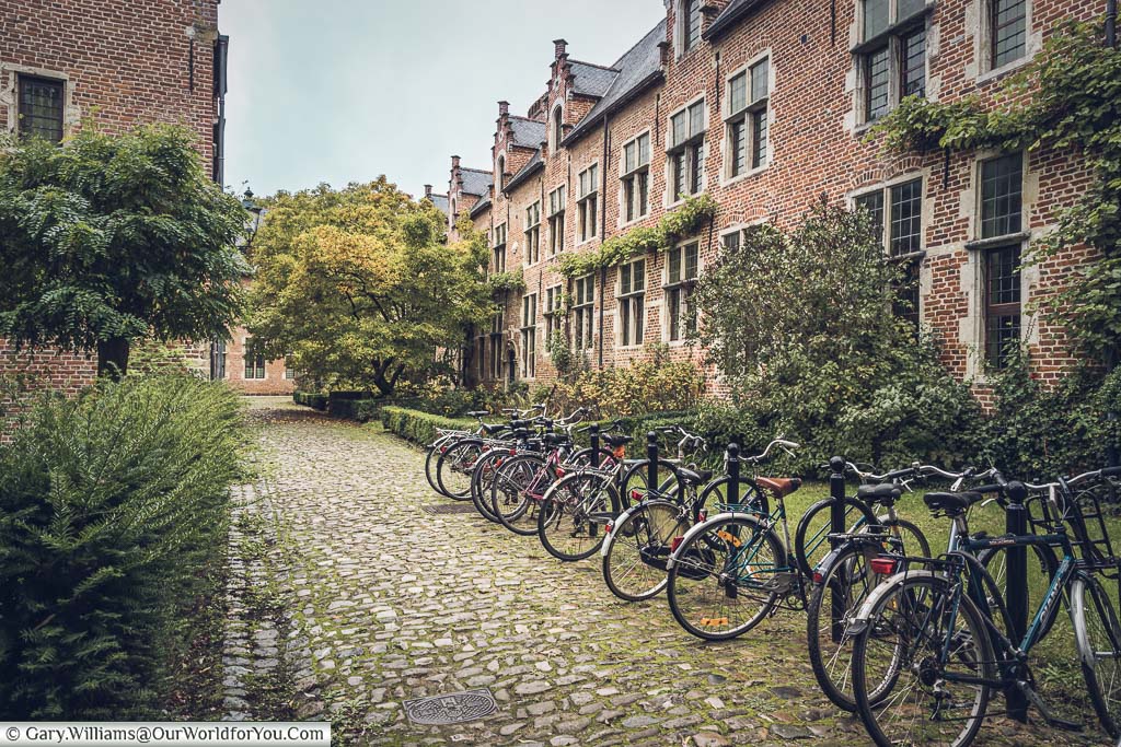Bicycles parked on a cobbled lane in the Great Beguinage in the belgium city of leuven.