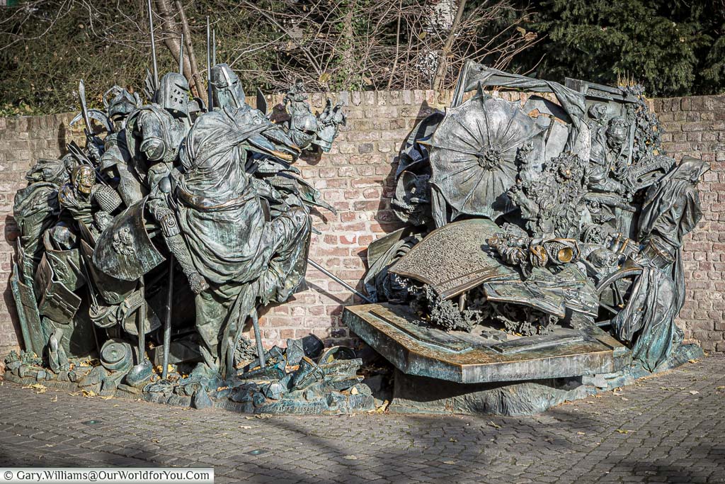 The detailed bronze sculpture shows scenes from the Battle of Worringen in the heart of düsseldorf, germany
