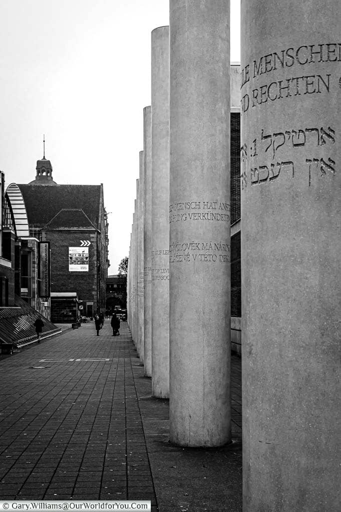 The concrete pillars with inscriptions in German and Yiddish line the Way of Human Rights in Nuremberg