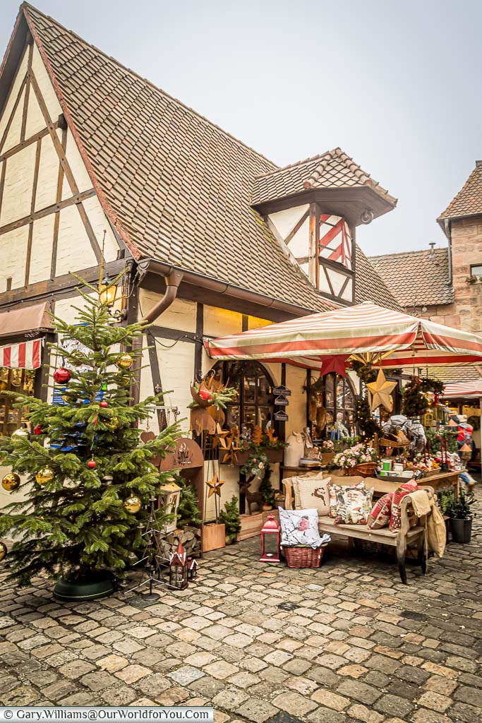 A stall outside a half-timbered house in the Craftsmens Courtyard german christmas markets in nuremberg