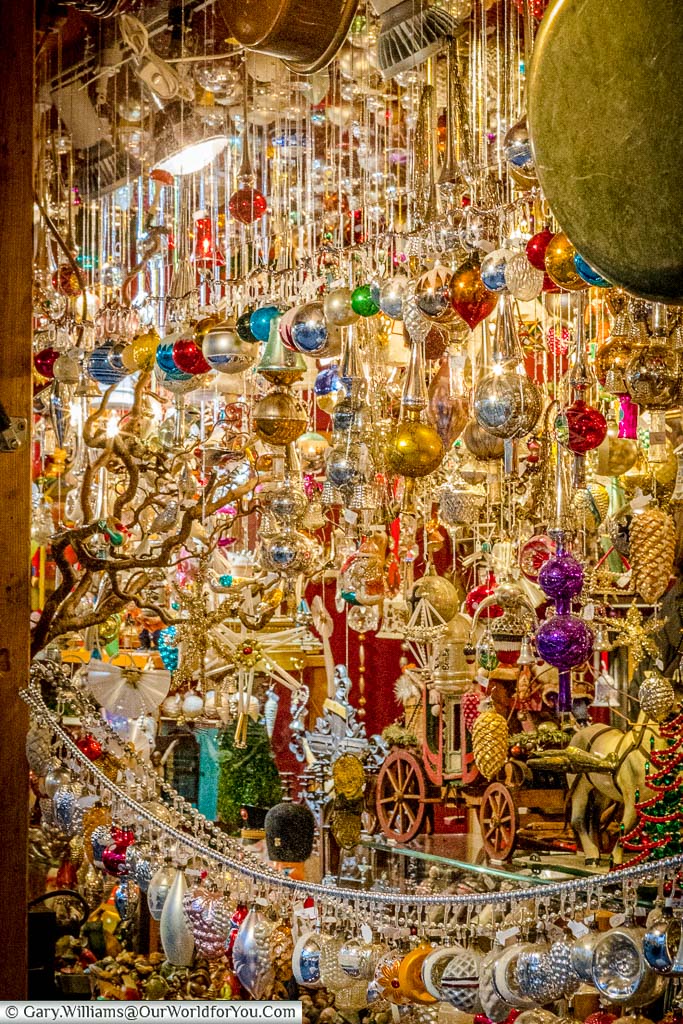 A close-up of a wide selection of vintage baubles on a stall in the Rindermarkt Christmas Market of Munich.