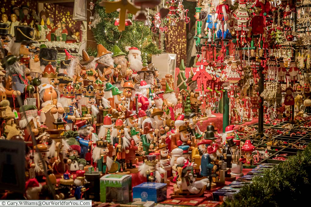 A stall on nuremberg's christmas market packed with wooden ornaments that art part of a traditional german christmas