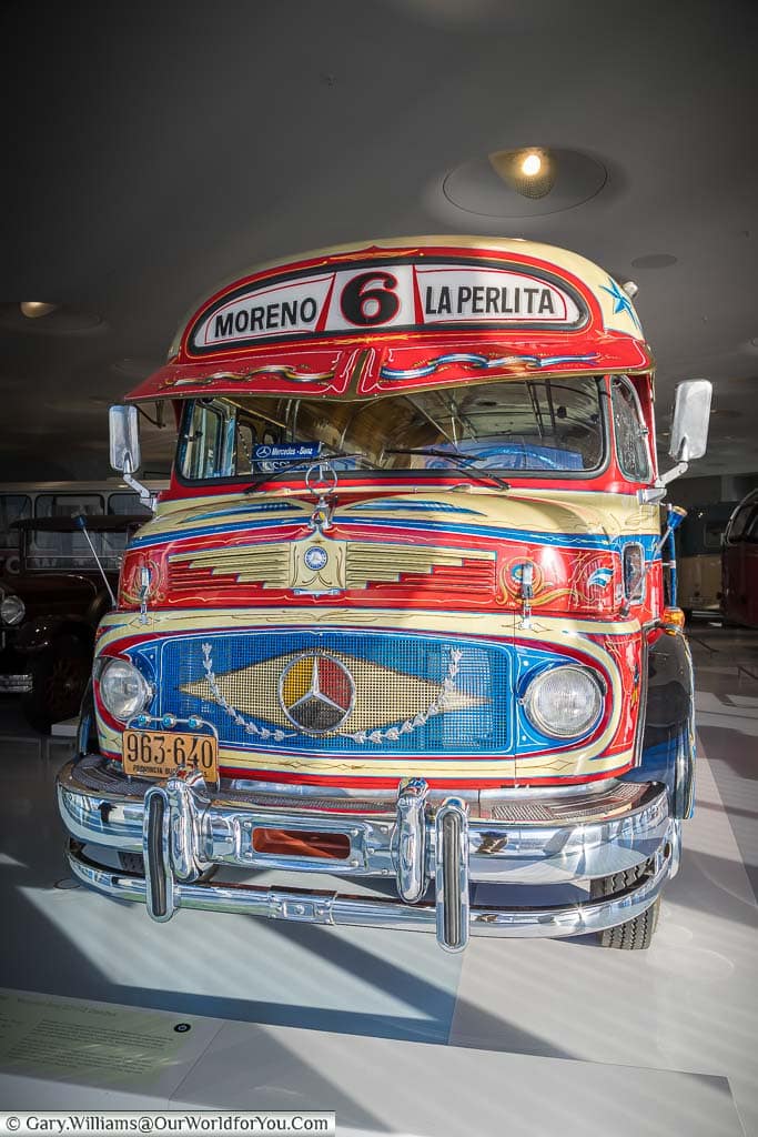 A brightly decorated 1970's Argentine Mercedes-Benz bus on display in the mercedes benz museum in stuttgart
