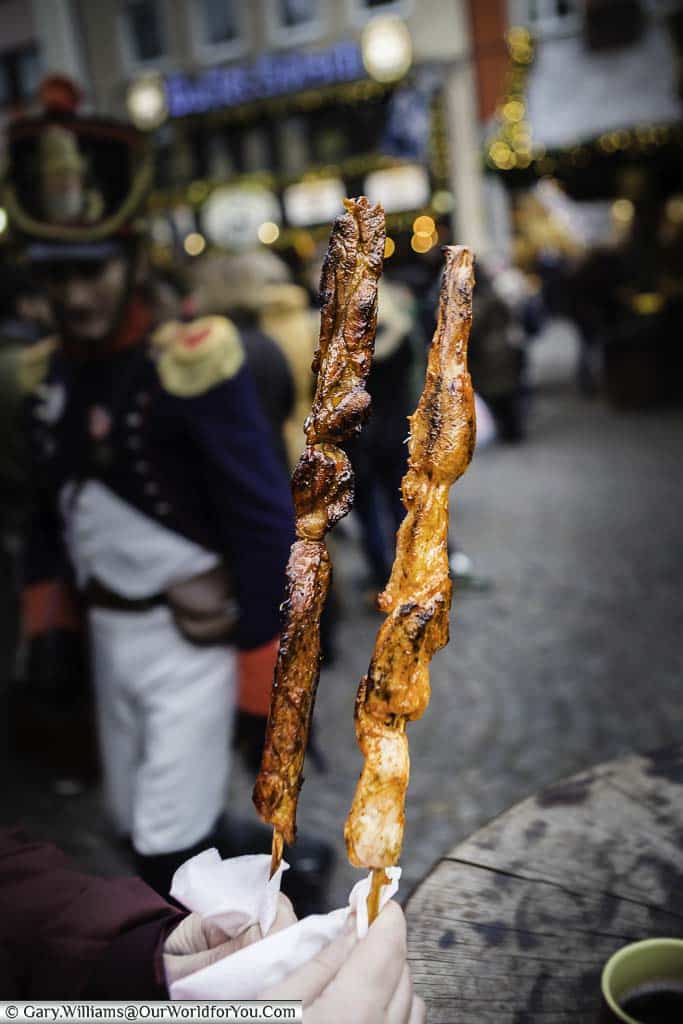 Two different foot-long meat kebabs from the cologne christmas markets