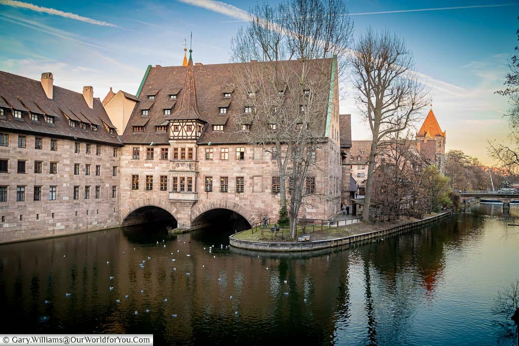 Nuremberg's iconic Heilig-Geist-Spital straddling the River Pegniz with the Schuldturm Tower in the background