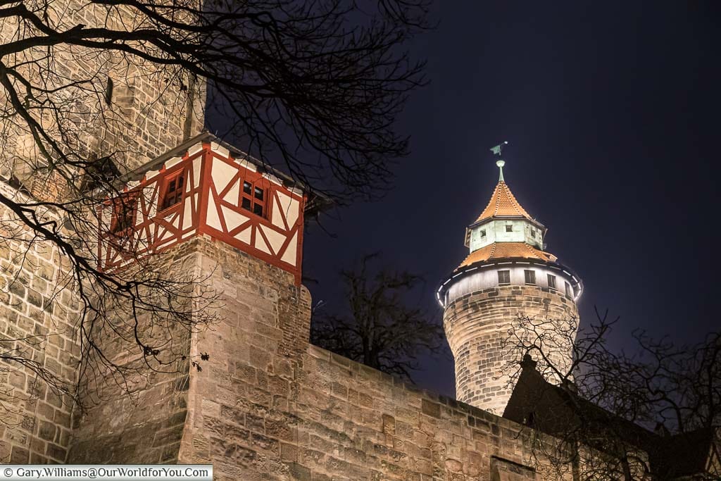 The illuminated walls and watchtower of nuremberg's imperial castle at night