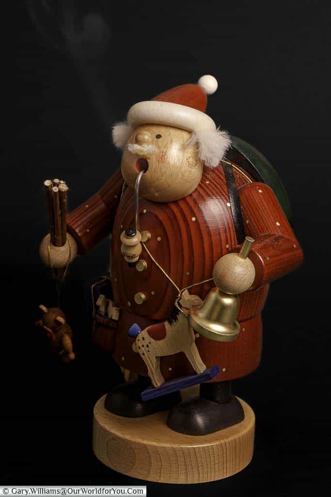 Our traditional wooden Santa Claus decoration with scented smoke coming from his pipe