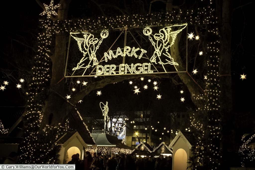One of the illuminated entrances to Cologne's Angel Christmas market at night