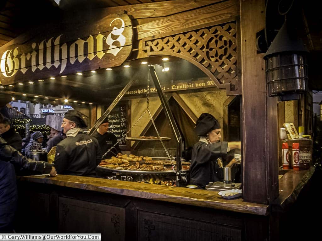 The Grillhaus, a carnivore's delight of meats and sausages cooked over charcoal in a decorative stall at cologne christmas markets