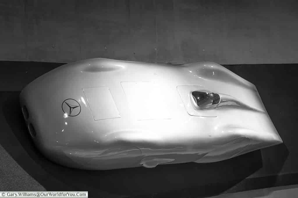 The experimental Mercedes-Benz W125 Rekordwagen, from 1937, with its streamlined bodywork a fixed to a banked road section inside the mercedes benz museum in stuttgart