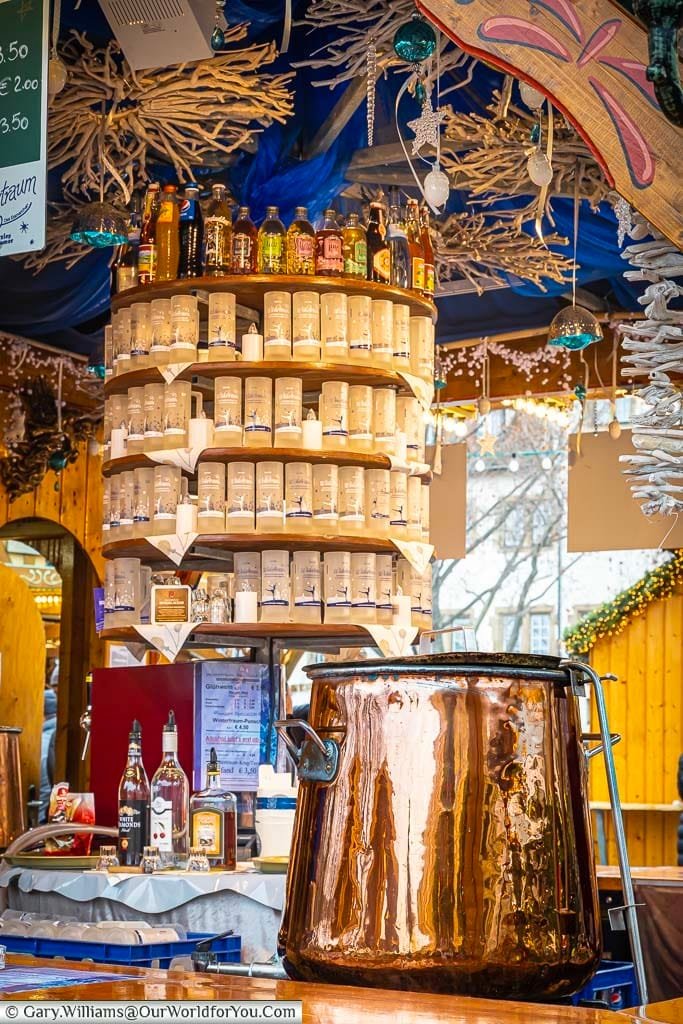 A large copper cauldron full of gluhwein at a drinks stall on stuttgart's christmas markets