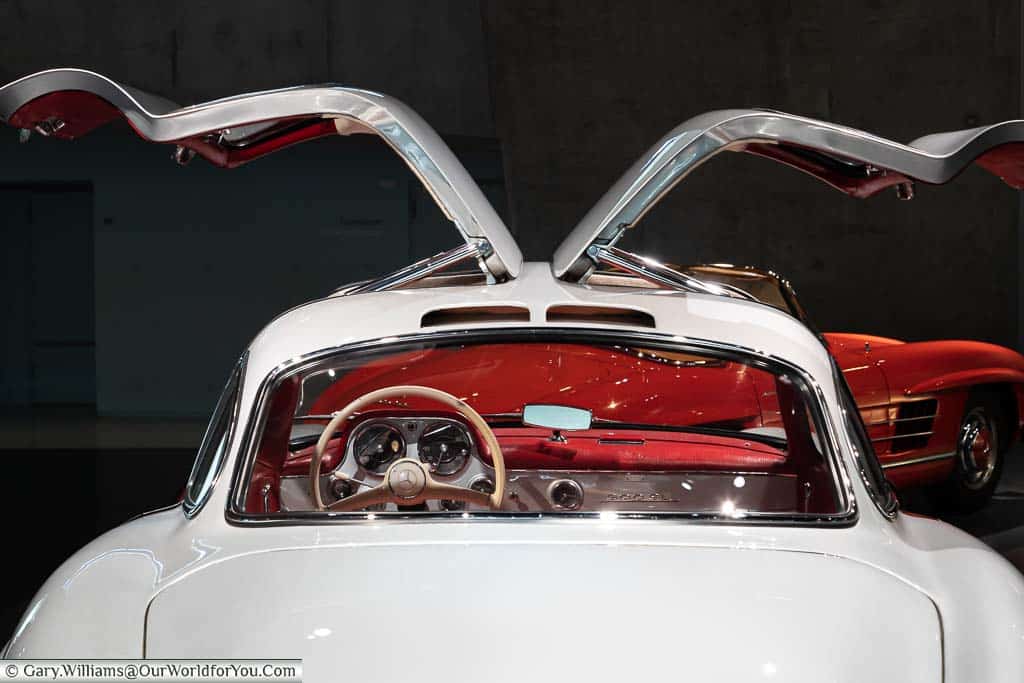 The rear view of a 1950's, gull-winged, 300 SL coupé in the mercedes benz museum in stuttgart