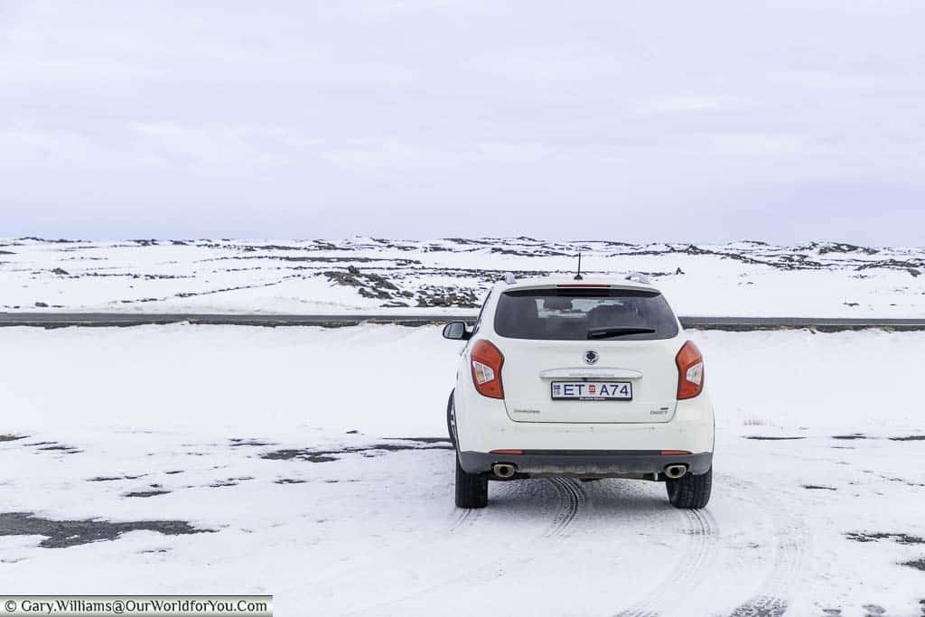 Our little 4x4 parked up in a snow-covered landscape in southern Iceland