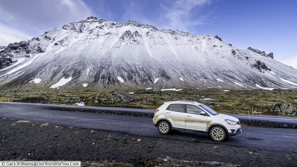 Etta parked in a layby just outside near Anrarstapi, in the west of iceland, in front of a snow-covered peak.