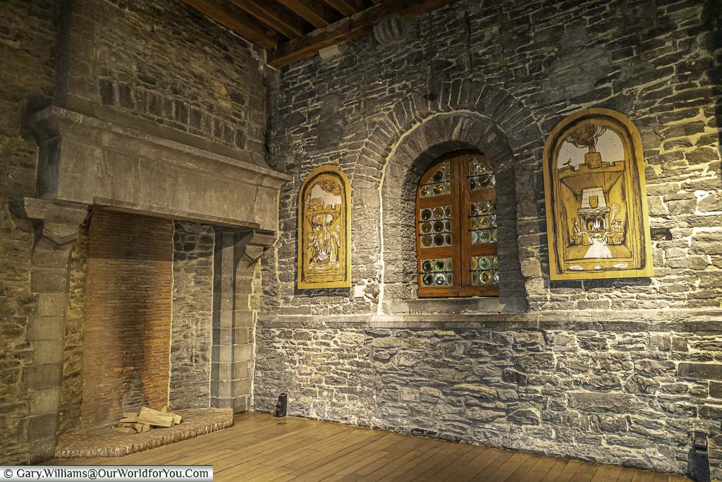 A giant stone fire place in one of the many rooms in the Castle of the Counts in ghent, belgium