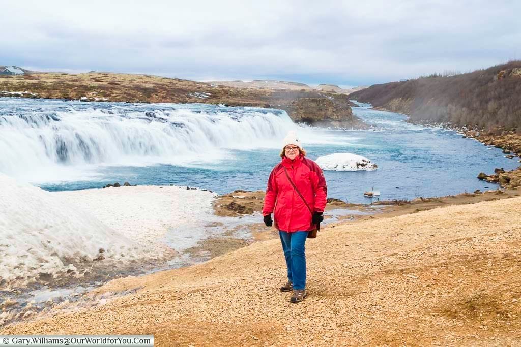 Janis, wrapped up warmly, in front of the Faxi waterfall