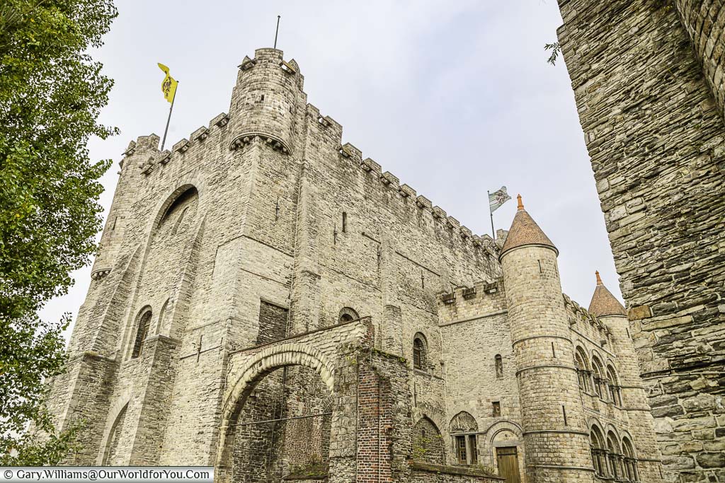 The stone keep and turreted towers of the Castle of the Counts in ghent, on a grey autumnal day
