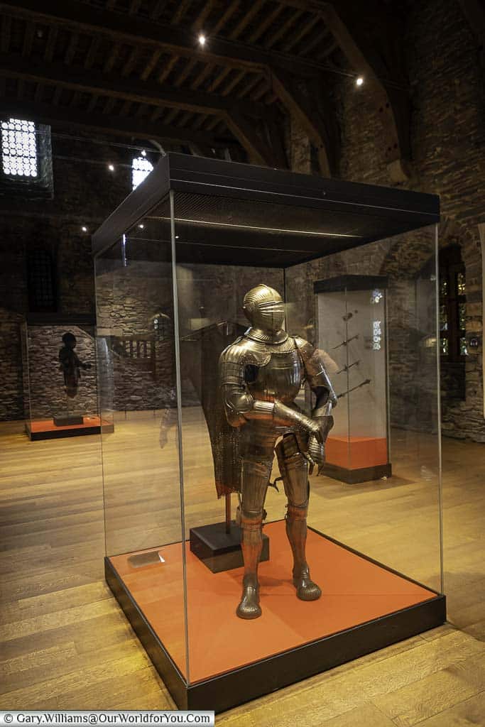 A suit of amour in a protective glass case in the Castle of the Counts in ghent, belgium