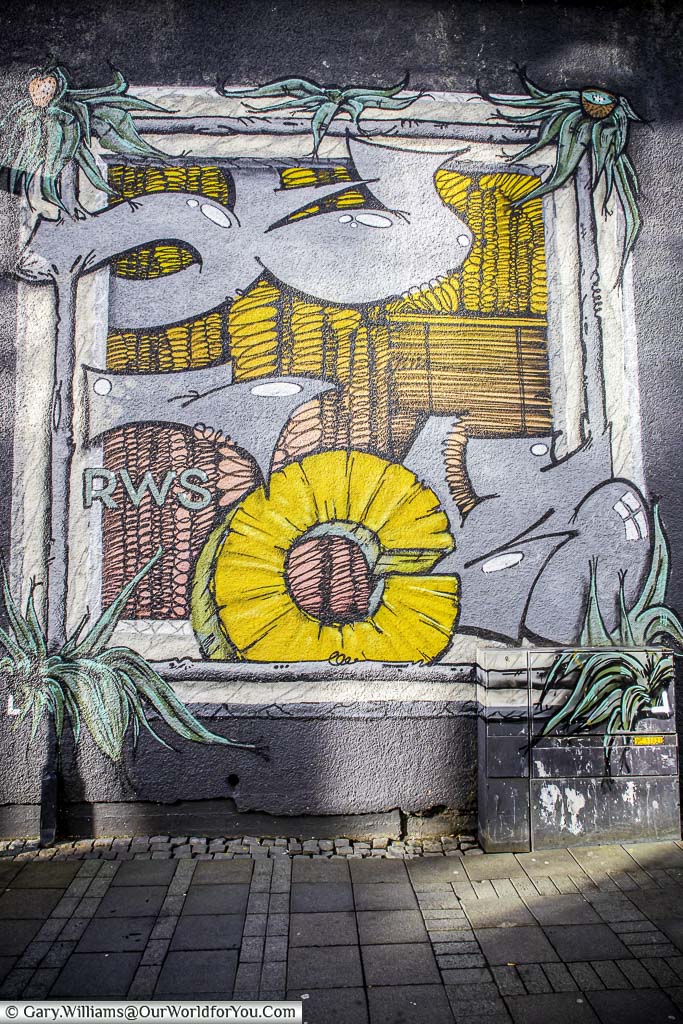 A piece of street art in downtown reykjavik featuring a pineapple slice.