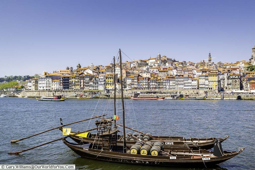 A couple of Rabelo boats from the Sandeman port house on the Douro River, opposite the Ribeira in Porto, Portugal