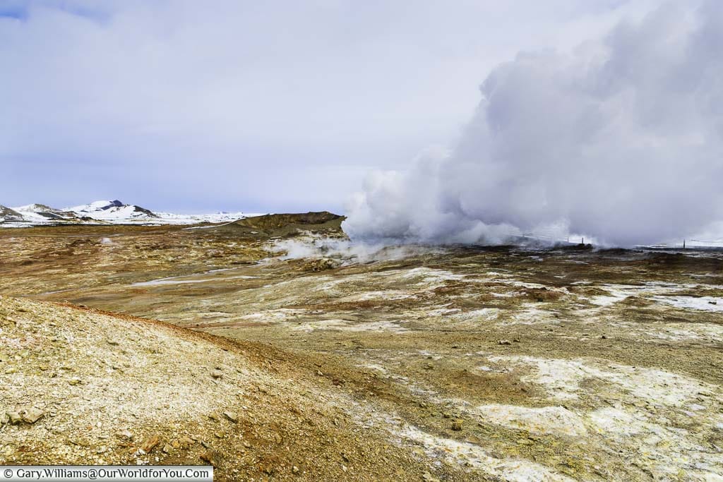Steam boiling up from underground thermal pools at the Gunnuhver Hot Springs in Iceland