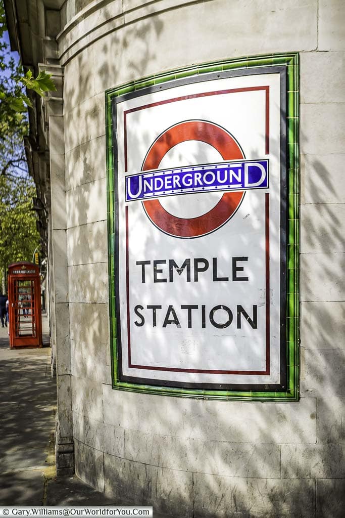 The curved, tiled sign to Temple Station Underground on the Embankment side of the tube station