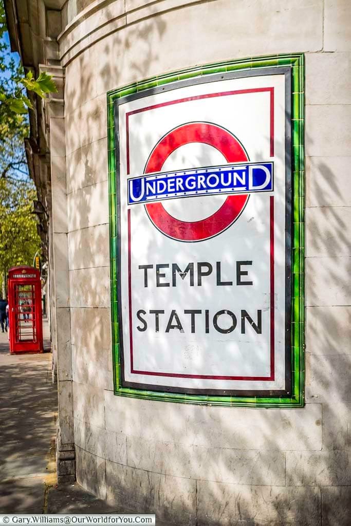 The curved, tiled sign to Temple Station Underground on the Embankment side of the tube station