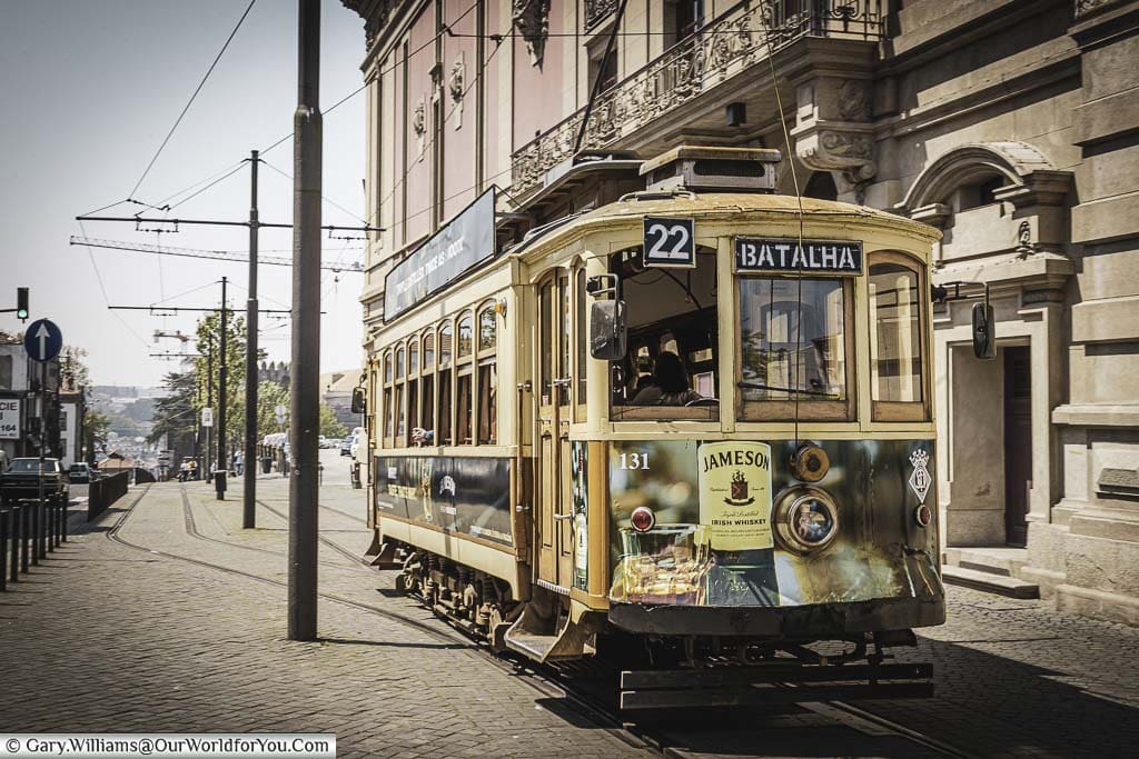 The number 22 Heritage tram, en route to Batalha, on the streets of Porto, Portugal
